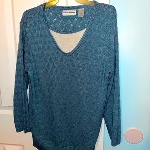 Ladies v-neck sweater with built in camisole.